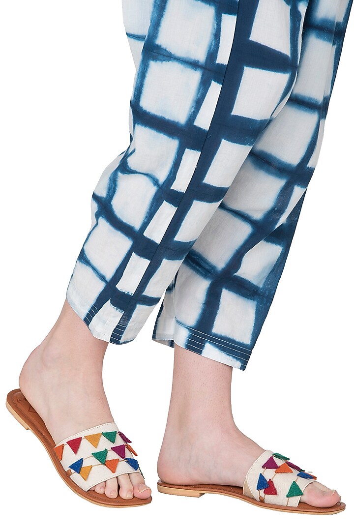 Tan and white layered sliders available only at Pernia's Pop Up Shop.