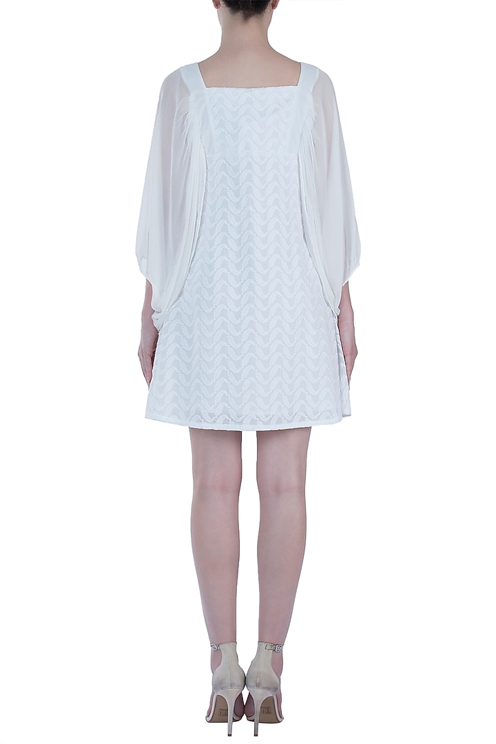 Ivory chikankari smock dress available only at Pernia's Pop Up Shop.