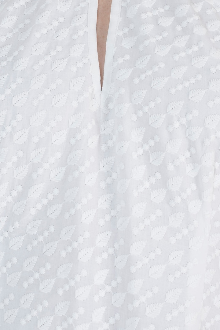 Ivory chikankari ruffle dress available only at Pernia's Pop Up Shop.