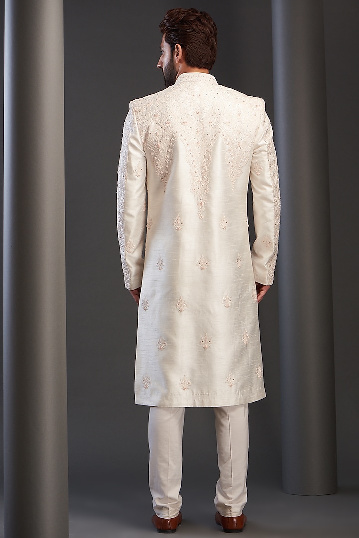 Ivory Raw Silk Hand Embroidered Groom Sherwani by GUJRALS at Pernia's Pop Up Shop
