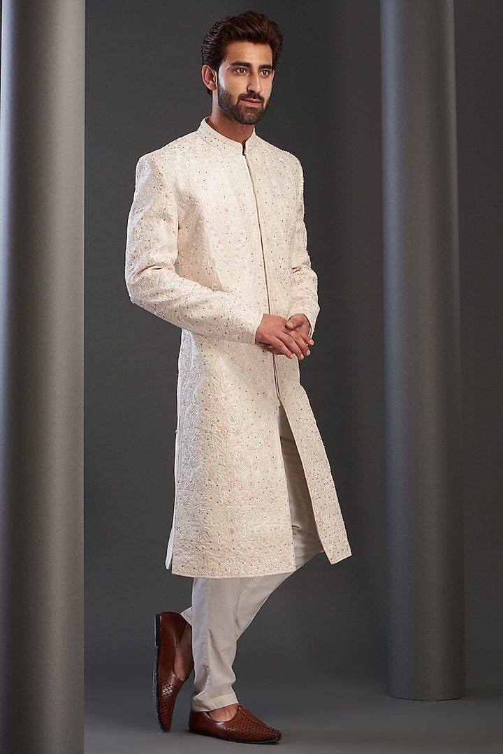 Ivory Raw Silk Hand Embroidered Groom Sherwani by GUJRALS at Pernia's Pop Up Shop