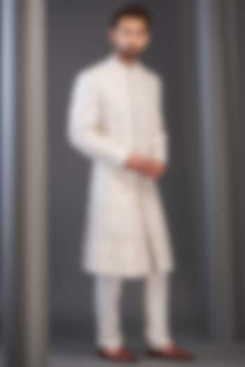 Ivory Raw Silk Embroidered Sherwani by GUJRALS