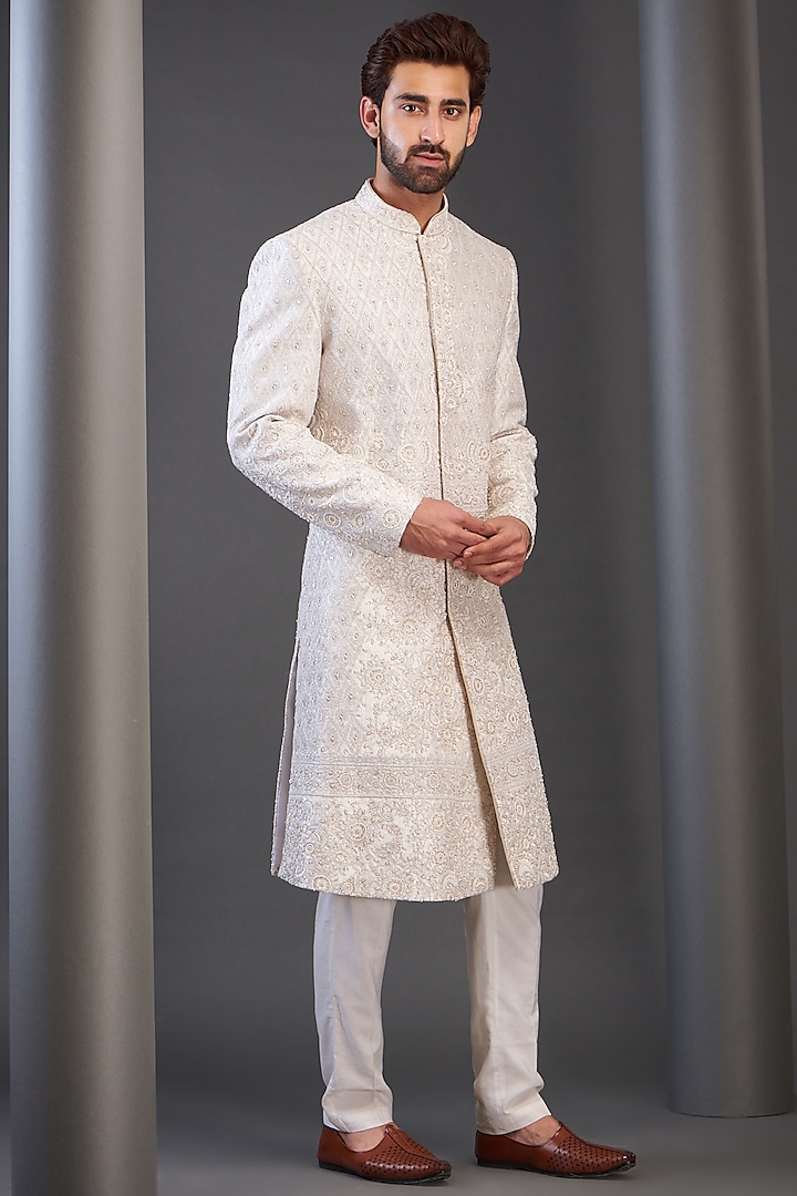 Ivory Raw Silk Embroidered Sherwani by GUJRALS