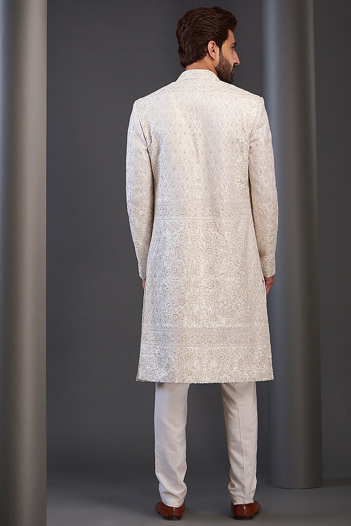 Ivory Raw Silk Embroidered Groom Sherwani by GUJRALS at Pernia's Pop Up Shop