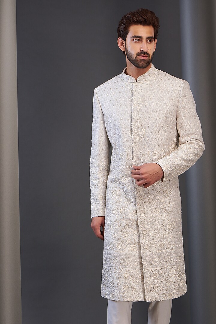 Ivory Raw Silk Embroidered Groom Sherwani by GUJRALS at Pernia's Pop Up Shop