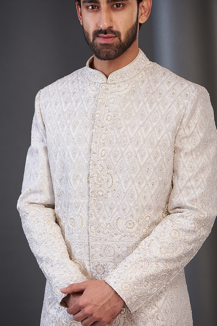 Ivory Raw Silk Embroidered Groom Sherwani by GUJRALS at Pernia's Pop Up Shop