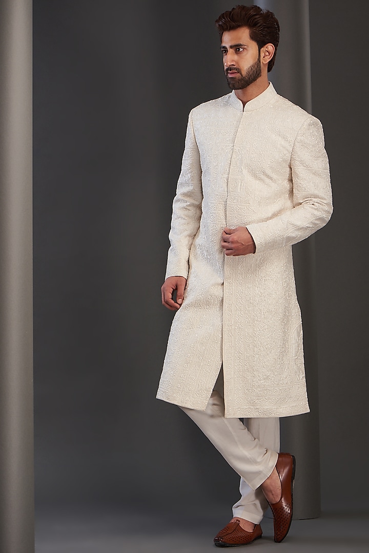 Ivory Raw Silk Embroidered Sherwani by GUJRALS