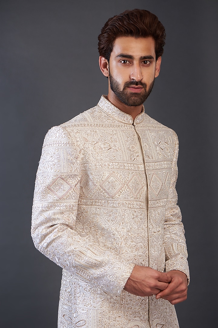 Ivory Raw Silk Embroidered Groom Sherwani by GUJRALS at Pernia's Pop Up Shop
