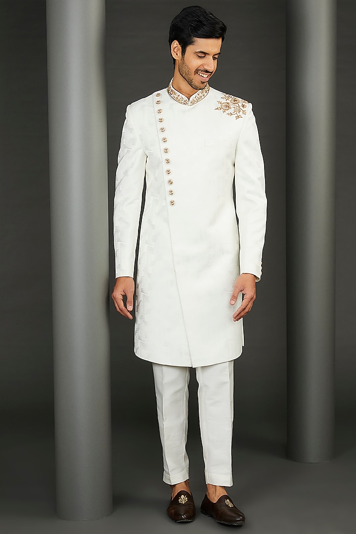 Ivory Jacquard Asymmetric Sherwani Set by GUJRALS