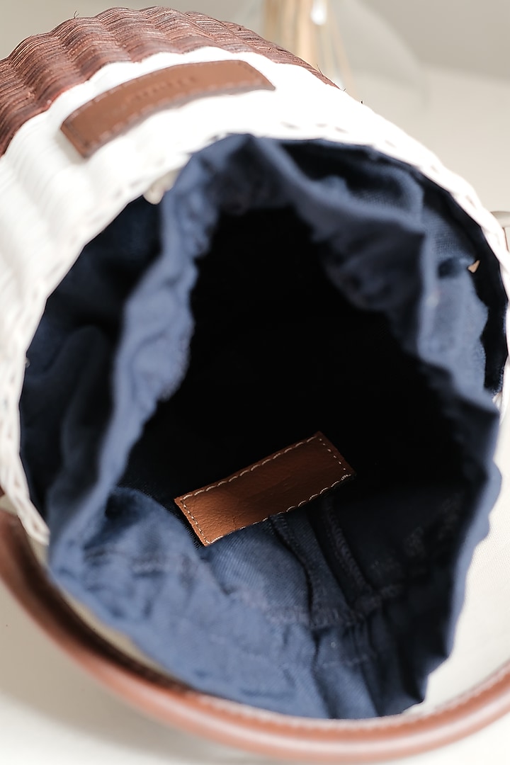 White & Brown Handwoven Bucket Sling by Hans (Handmade) at Pernia's Pop Up Shop