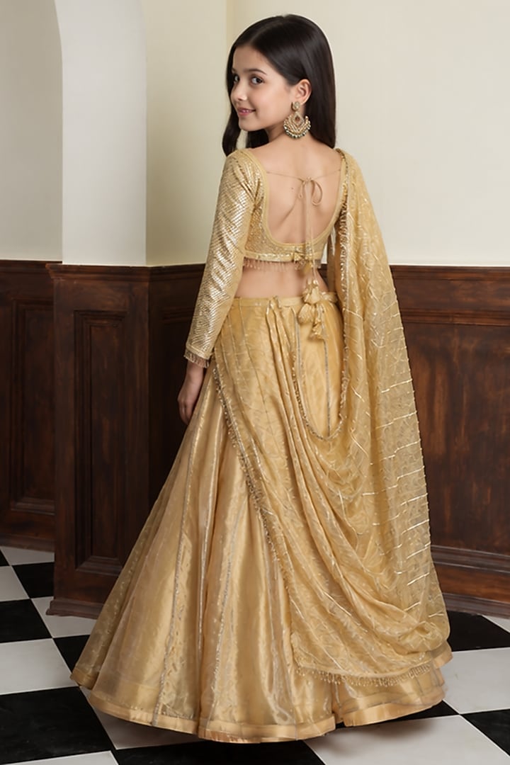 Gold Pure Tissue Lehenga Set For Girls by Harmony at Pernia's Pop Up Shop