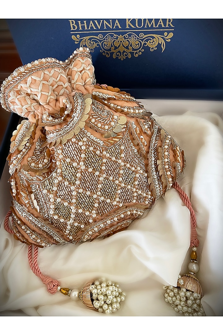 Peach Hand Embroidered Potli by BHAVNA KUMAR at Pernia's Pop Up Shop