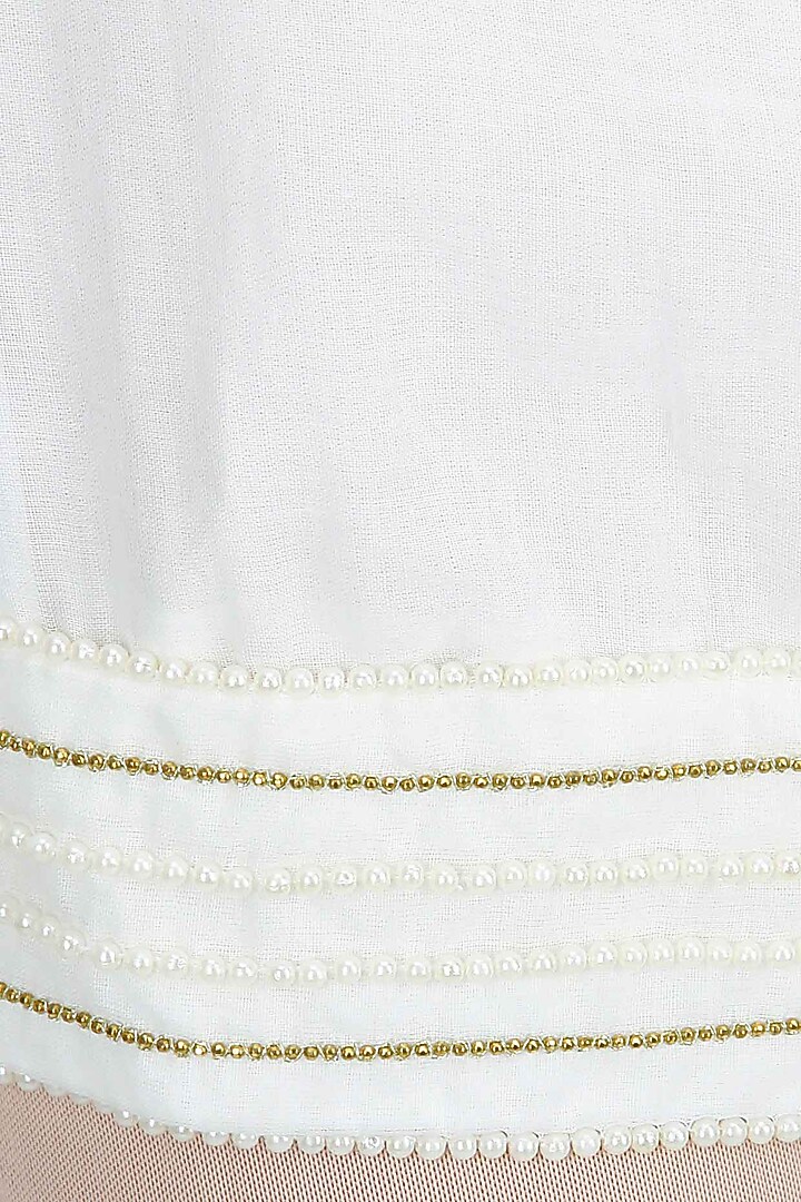 White pearl embroidered kediya short dress available only at Pernia's Pop-Up Shop.