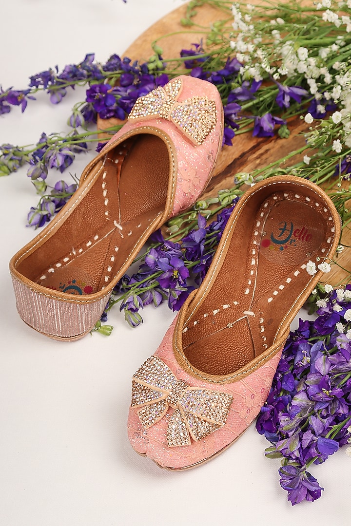Peach Leatherette Embellished Juttis For Girls by Hello Jr at Pernia's Pop Up Shop