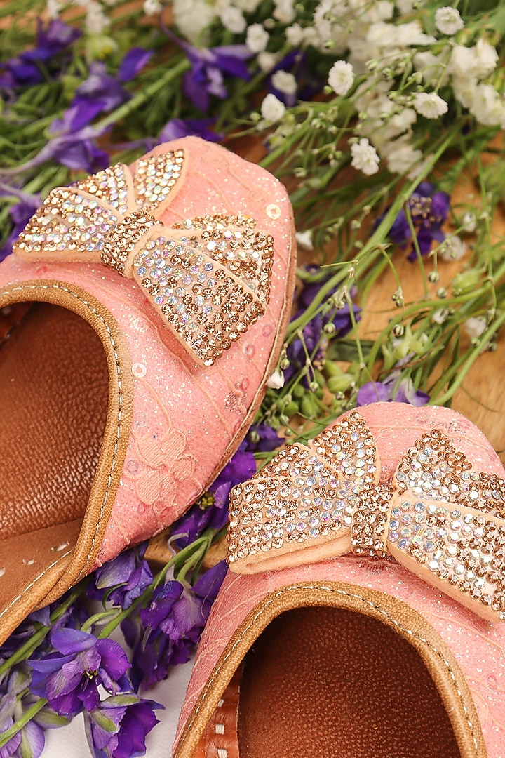 Peach Leatherette Embellished Juttis For Girls by Hello Jr at Pernia's Pop Up Shop