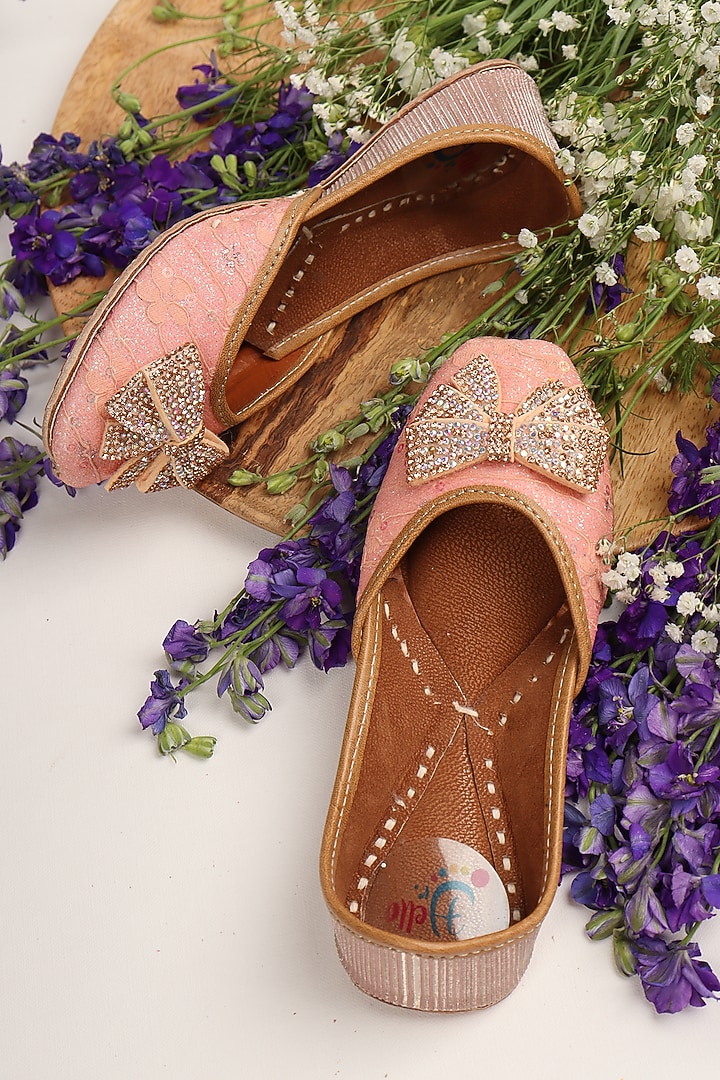 Peach Leatherette Embellished Juttis For Girls by Hello Jr at Pernia's Pop Up Shop
