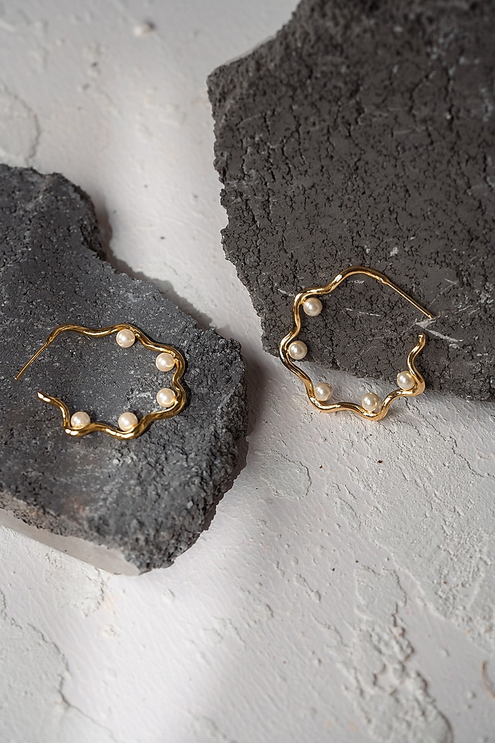 Gold Finish Pearl Handcrafted Swirl Hoop Earrings by Hermosa By Srishti Bajaj at Pernia's Pop Up Shop
