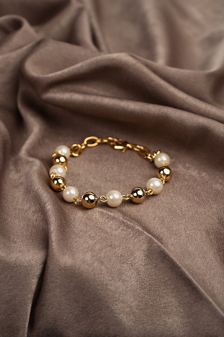 Gold Finish Pearl Bracelet by Hermosa By Srishti Bajaj at Pernia's Pop Up Shop