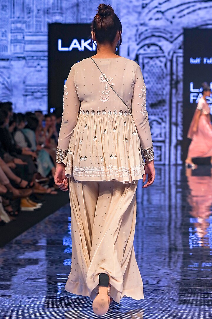 Ecru Embroidered Top With Flared Pants by Half Full Curve at Pernia's Pop Up Shop