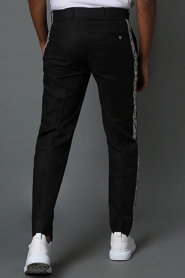 Black Embroidered Pants by HOUSE OF THREE MEN at Pernia's Pop Up Shop