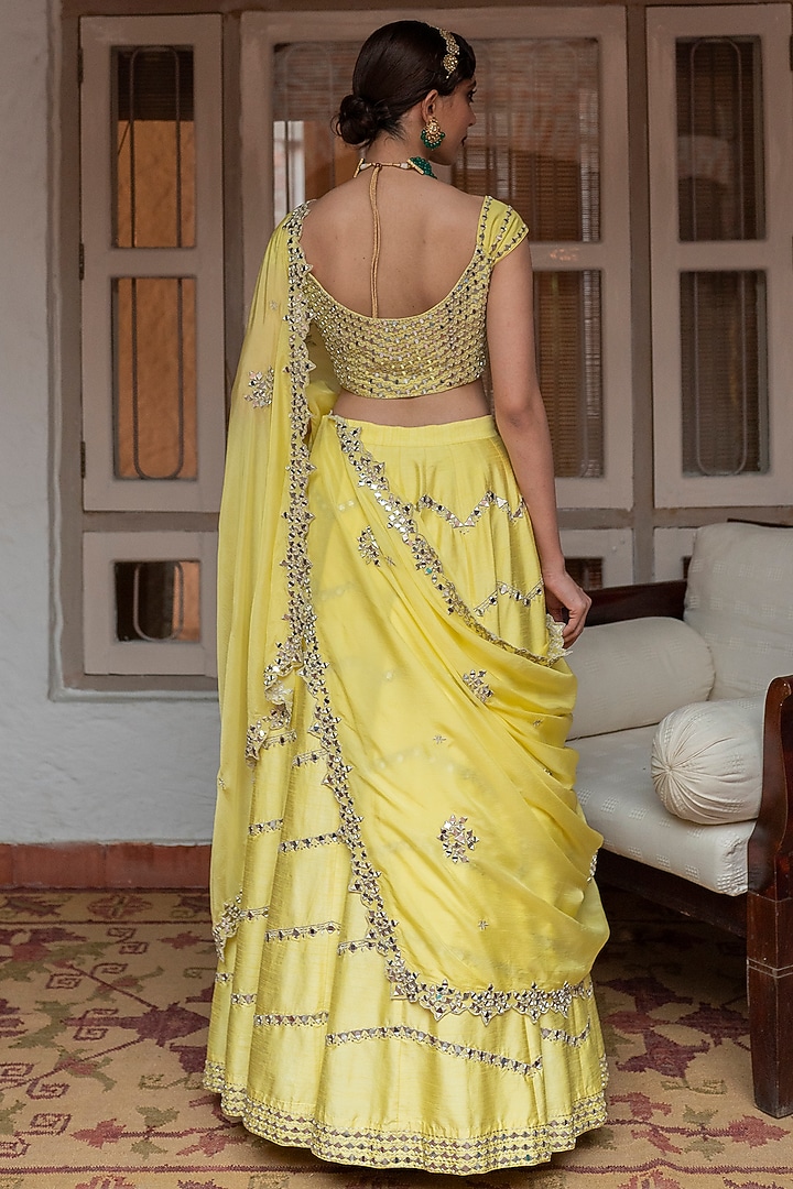 Yellow Mirror Embroidered Wedding Lehenga Set by House of dasmaya at Pernia's Pop Up Shop