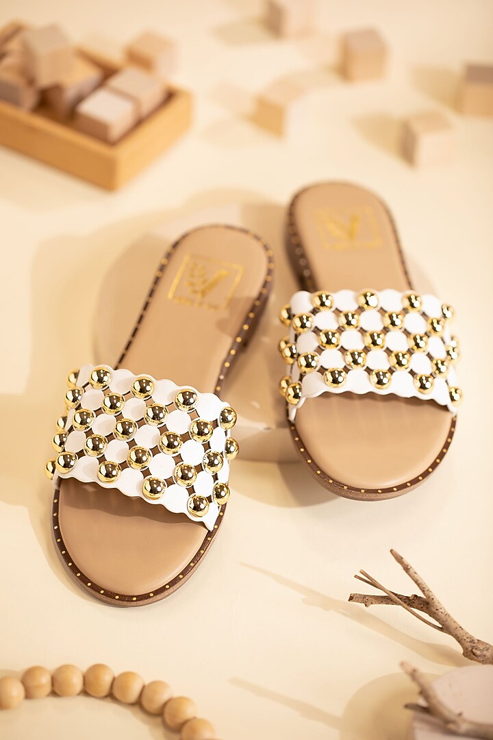 White Faux Leather Cutwork Flats by House of Vian at Pernia's Pop Up Shop