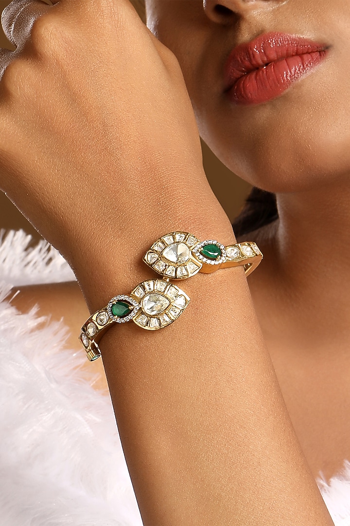 Micron Gold Finish Kundan Polki & Emerald Stone Enameled Bracelet by Hrisha Jewels at Pernia's Pop Up Shop