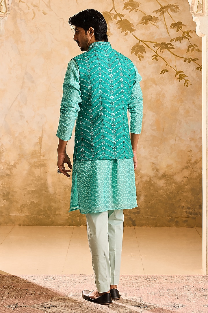 Teal Raw Silk Resham Embroidered Bundi Jacket Set by NITIKA GUJRAL MEN at Pernia's Pop Up Shop