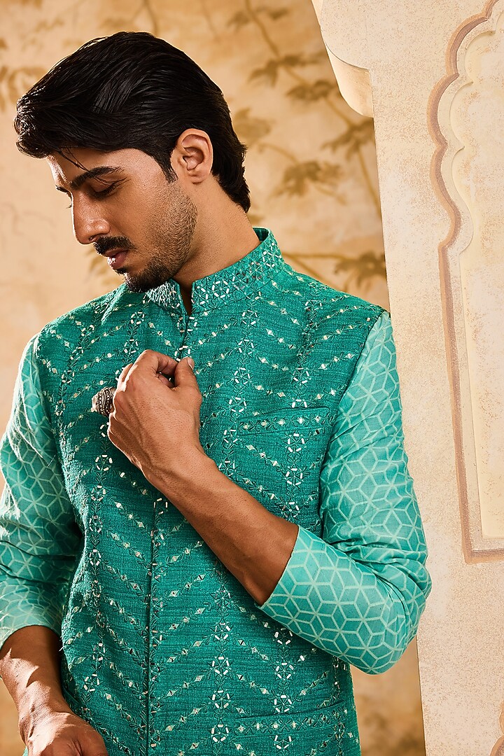 Teal Raw Silk Resham Embroidered Bundi Jacket Set by NITIKA GUJRAL MEN at Pernia's Pop Up Shop