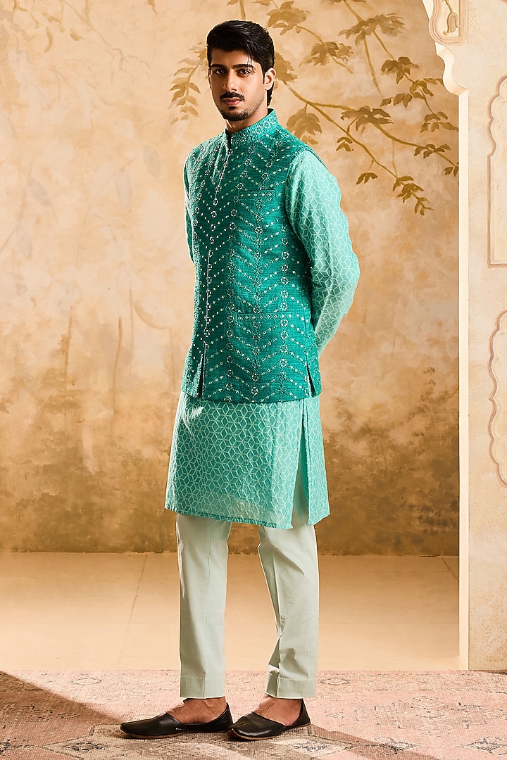 Teal Raw Silk Resham Embroidered Bundi Jacket Set by NITIKA GUJRAL MEN at Pernia's Pop Up Shop