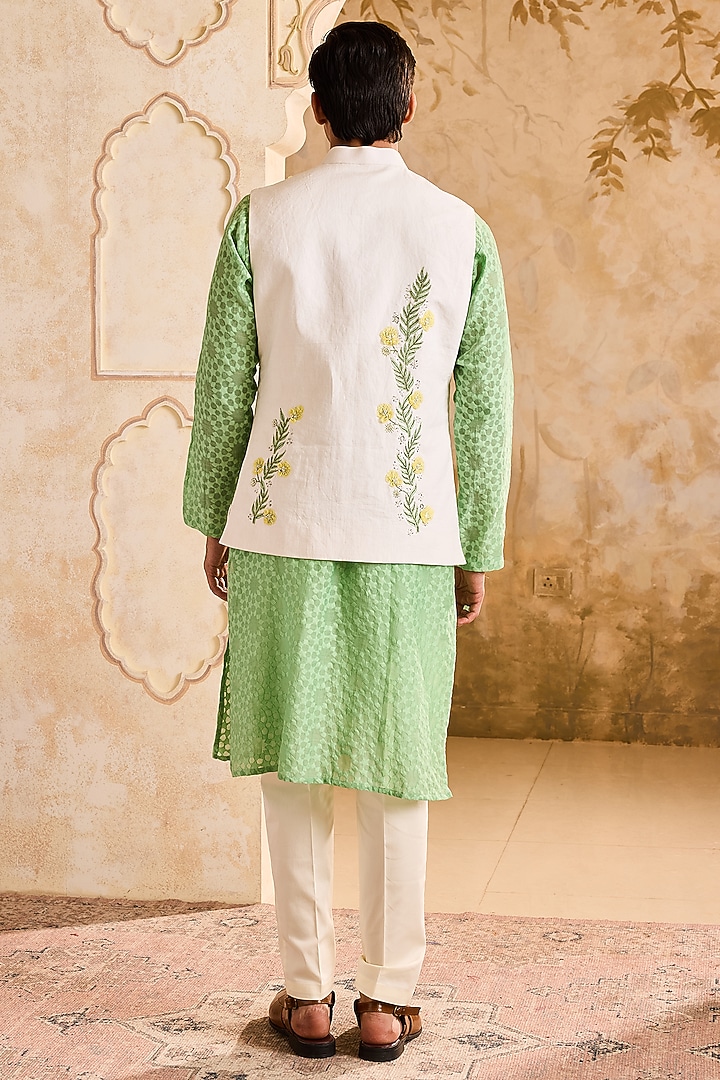 Ivory Linen 3D Floral Embroidered Bundi Jacket Set by NITIKA GUJRAL MEN at Pernia's Pop Up Shop