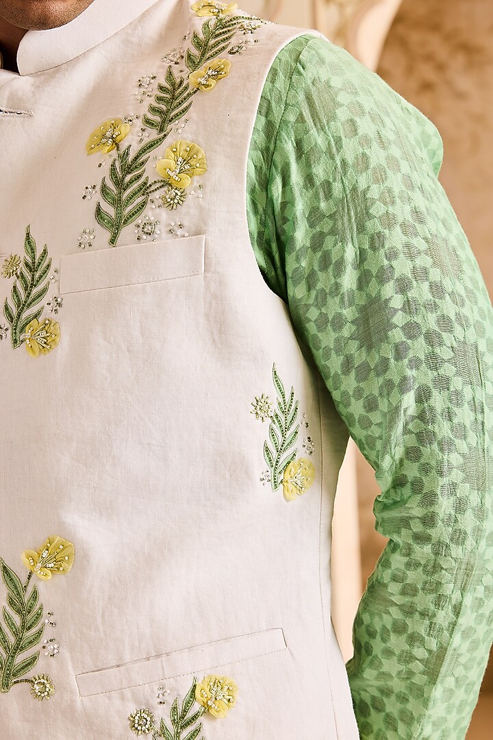 Ivory Linen 3D Floral Embroidered Bundi Jacket Set by NITIKA GUJRAL MEN at Pernia's Pop Up Shop