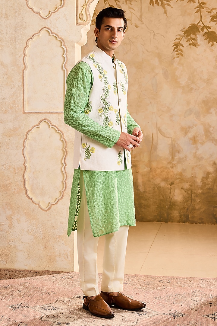 Ivory Linen 3D Floral Embroidered Bundi Jacket Set by NITIKA GUJRAL MEN at Pernia's Pop Up Shop