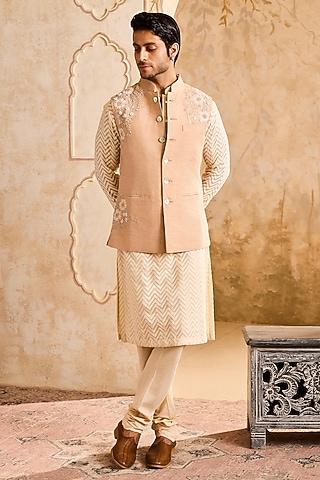 Beige Linen 3D Floral Embroidered Bundi Jacket Set by NITIKA GUJRAL MEN