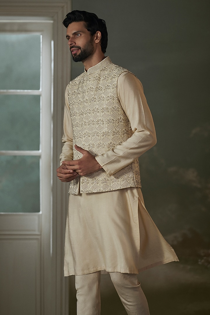 Beige Raw Silk Crystal Embroidered Bundi Jacket Set by NITIKA GUJRAL MEN at Pernia's Pop Up Shop