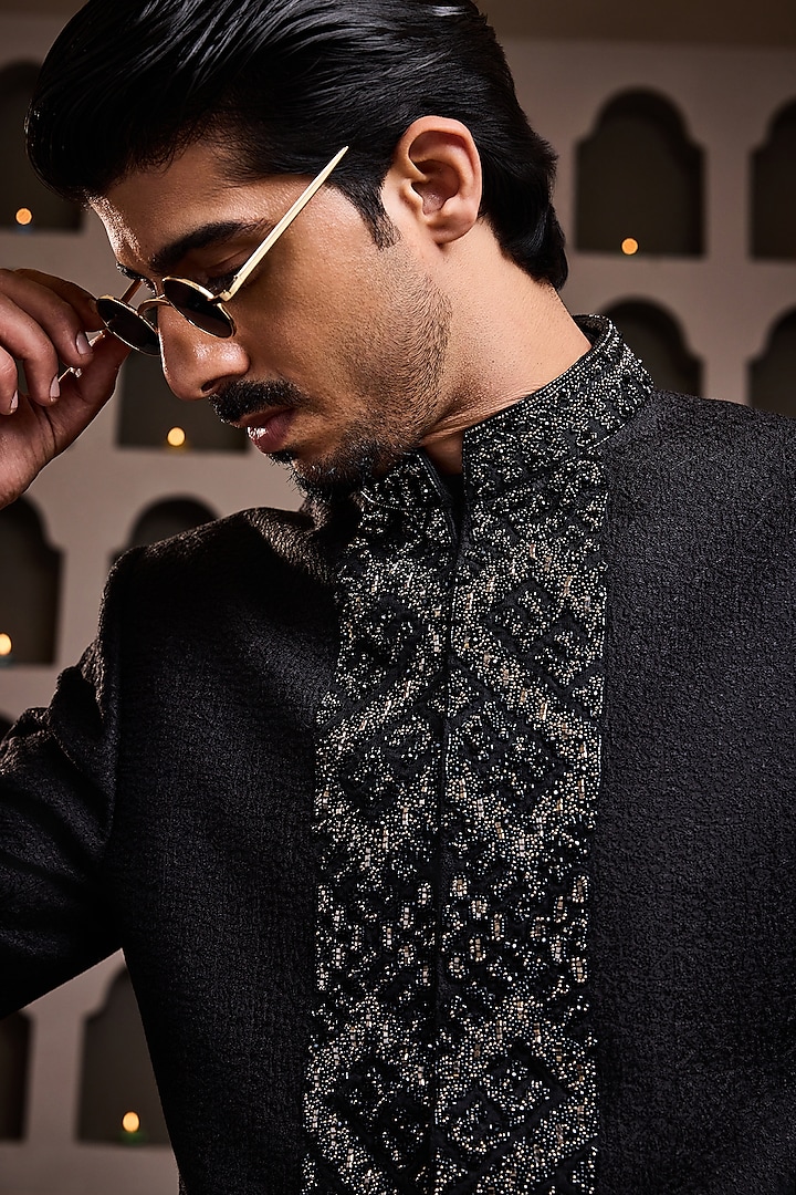 Black Raw Silk Resham Embroidered Jodhpuri Set by NITIKA GUJRAL MEN at Pernia's Pop Up Shop
