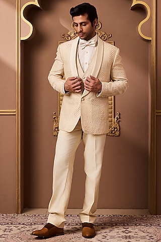 Beige Raw Silk Resham Embroidered Tuxedo Set by NITIKA GUJRAL MEN
