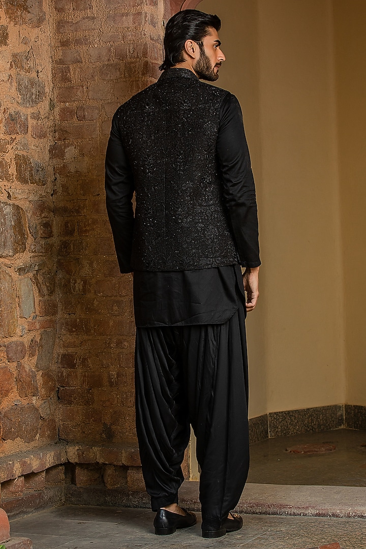 Black Raw Silk Embroidered Bundi Jacket Set by NITIKA GUJRAL MEN at Pernia's Pop Up Shop