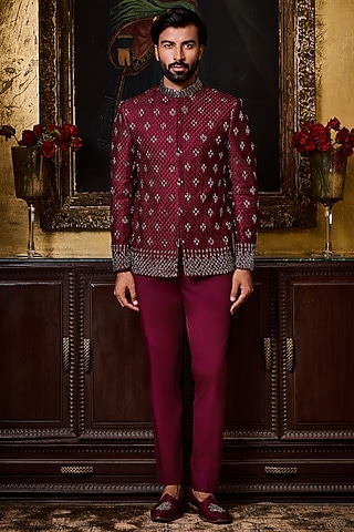 Burgundy Raw Silk Resham Embroidered Jodhpuri Set by NITIKA GUJRAL MEN