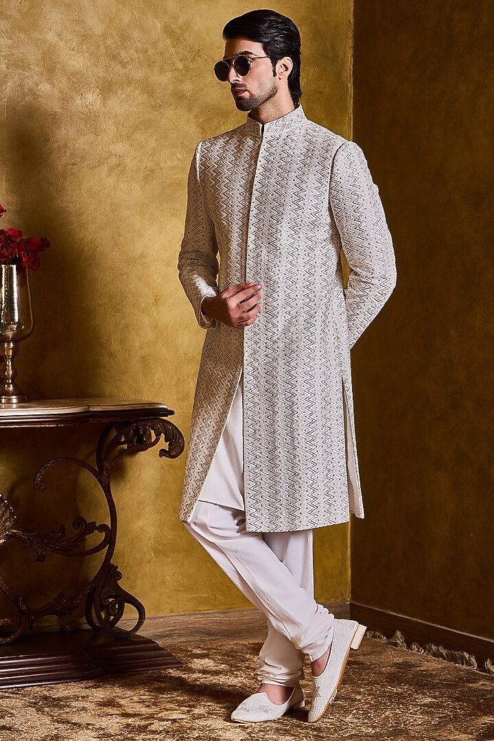 Ivory Raw Silk Resham Embroidered Groom Sherwani Set by NITIKA GUJRAL MEN at Pernia's Pop Up Shop