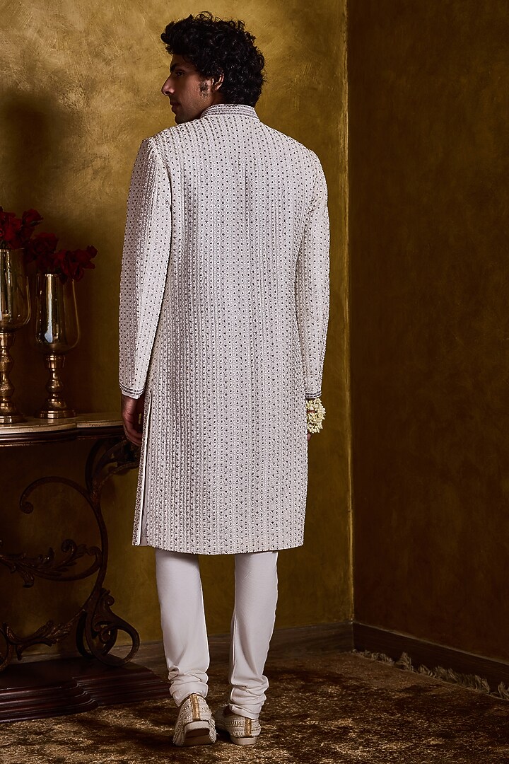 Ivory Raw Silk Resham Embroidered Groom Sherwani Set by NITIKA GUJRAL MEN at Pernia's Pop Up Shop