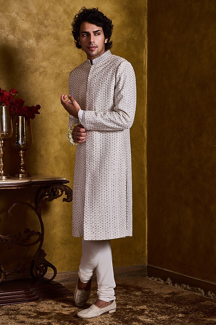Ivory Raw Silk Resham Embroidered Groom Sherwani Set by NITIKA GUJRAL MEN at Pernia's Pop Up Shop