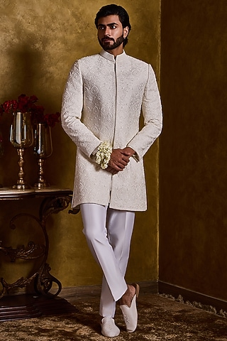 Ivory Raw Silk Resham Embroidered Sherwani Set by NITIKA GUJRAL MEN
