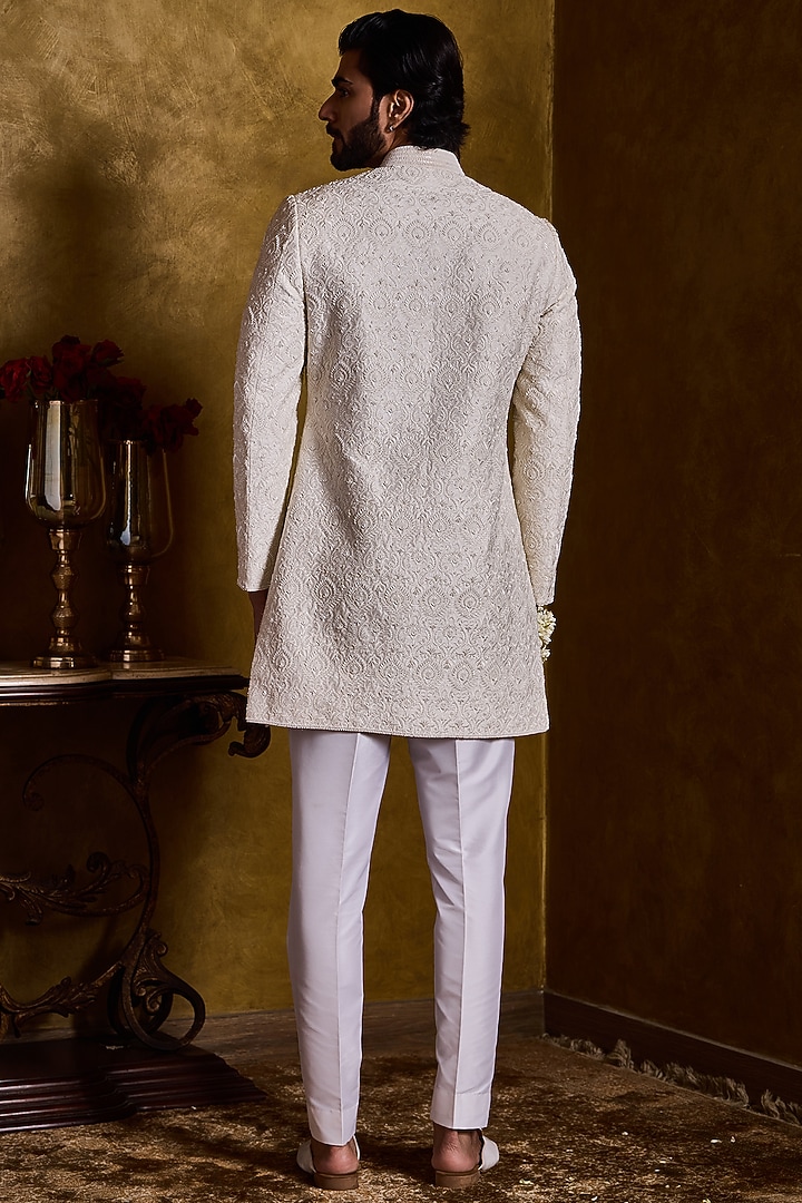 Ivory Raw Silk Resham Embroidered Groom Sherwani Set by NITIKA GUJRAL MEN at Pernia's Pop Up Shop