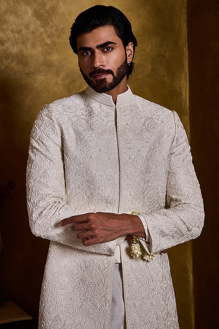 Ivory Raw Silk Resham Embroidered Groom Sherwani Set by NITIKA GUJRAL MEN at Pernia's Pop Up Shop