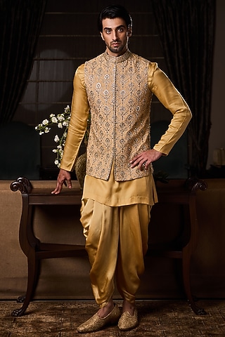 Gold Raw Silk Sequins Embroidered Bundi Jacket Set by NITIKA GUJRAL MEN