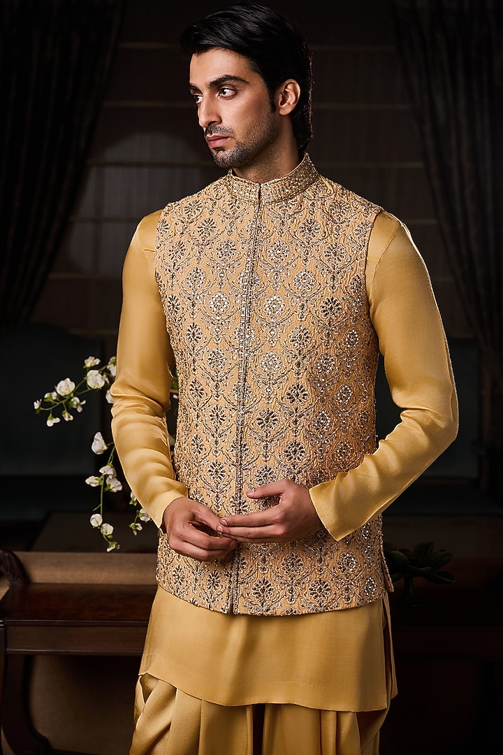 Gold Raw Silk Sequins Embroidered Bundi Jacket Set by NITIKA GUJRAL MEN at Pernia's Pop Up Shop