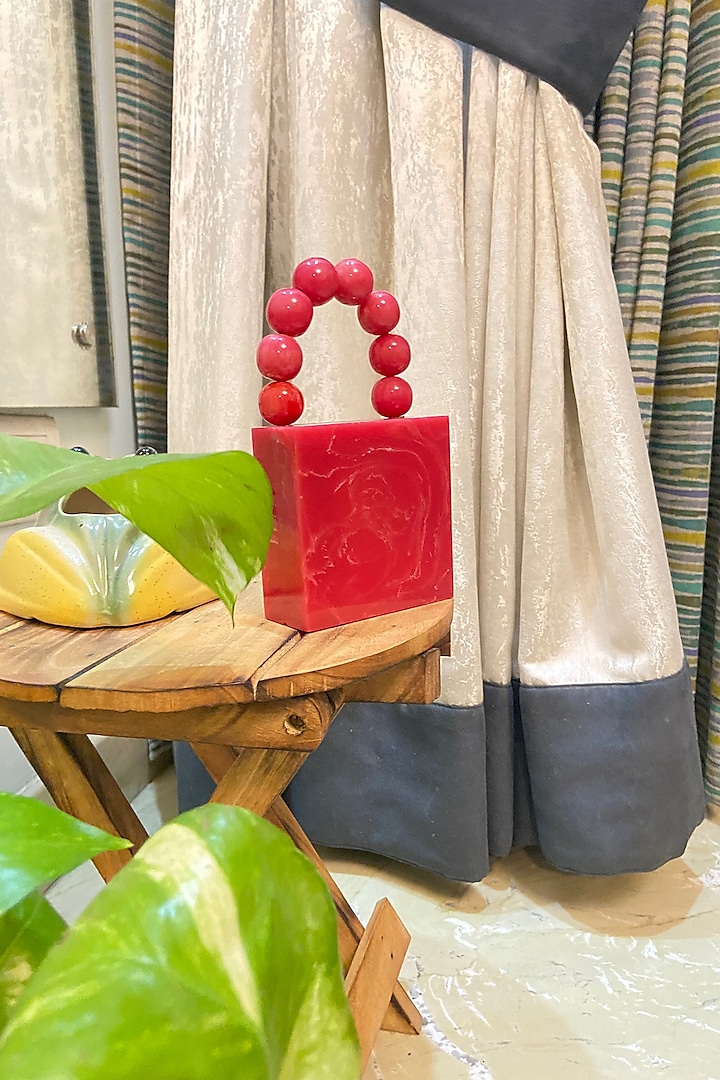 Red Resin Clutch by HANDLE THOSE BAGS at Pernia's Pop Up Shop