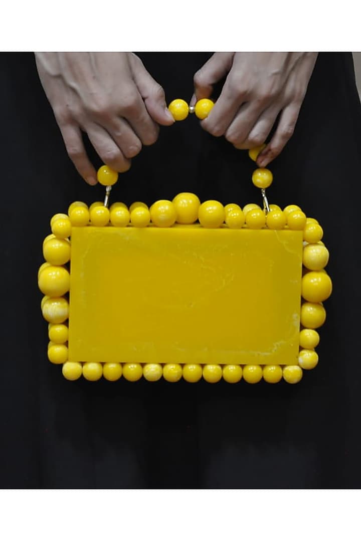 Yellow Resin Embellished Sling Bag by HANDLE THOSE BAGS at Pernia's Pop Up Shop