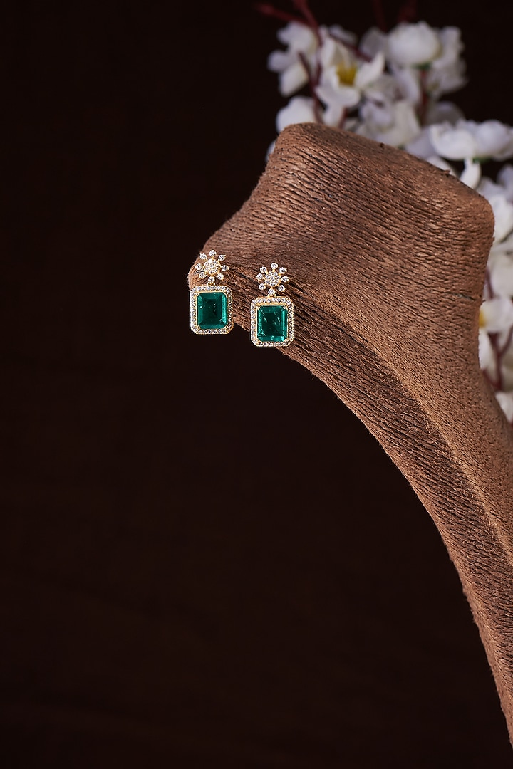 Gold Finish Moissanite Polki & Synthetic Emerald Stud Earrings In Sterling Silver by Hunar at Pernia's Pop Up Shop